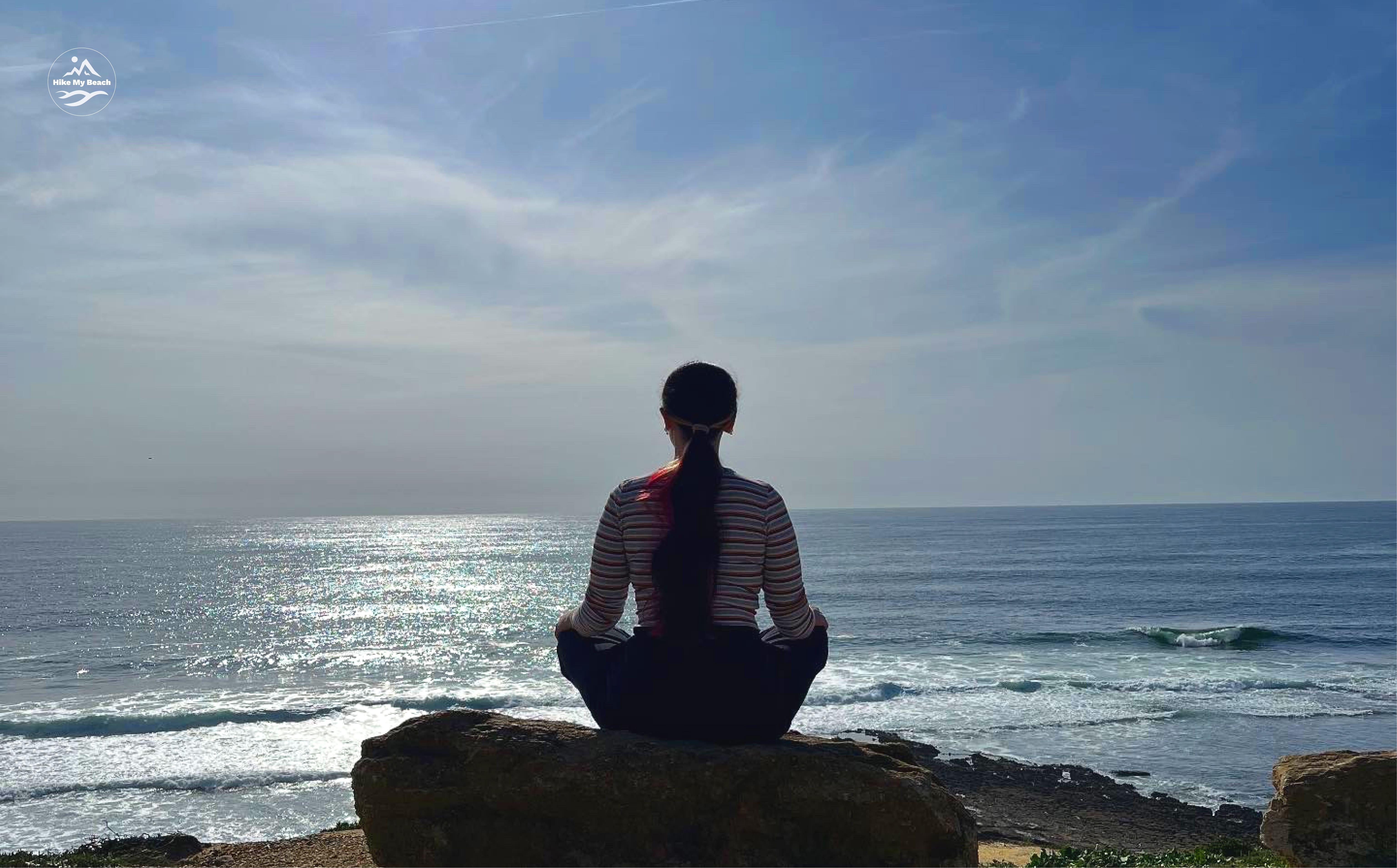 woman breathing at the ocean